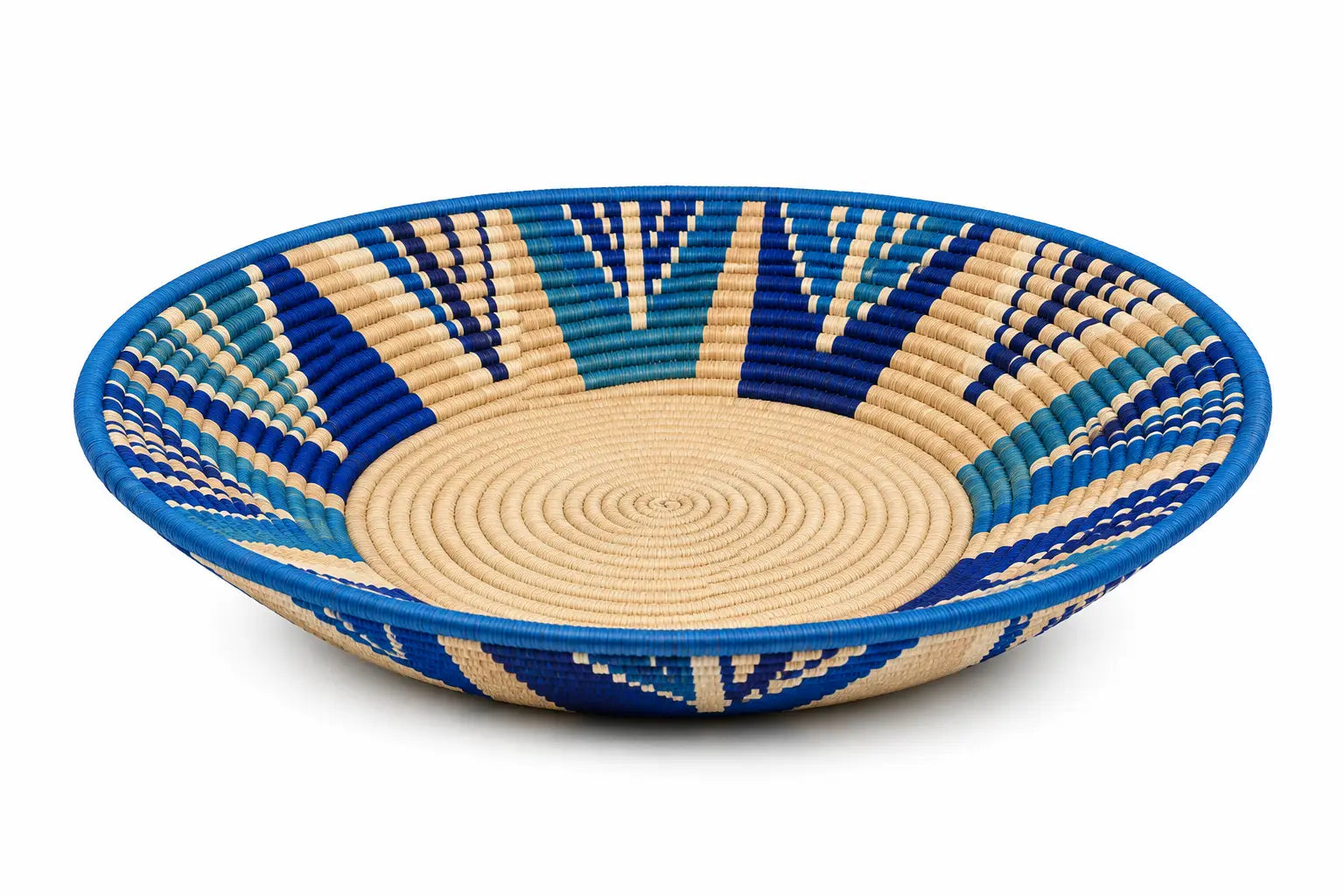 Handwoven blue and cream decorative shallow basket bowl with a geometric pattern for home decor.
