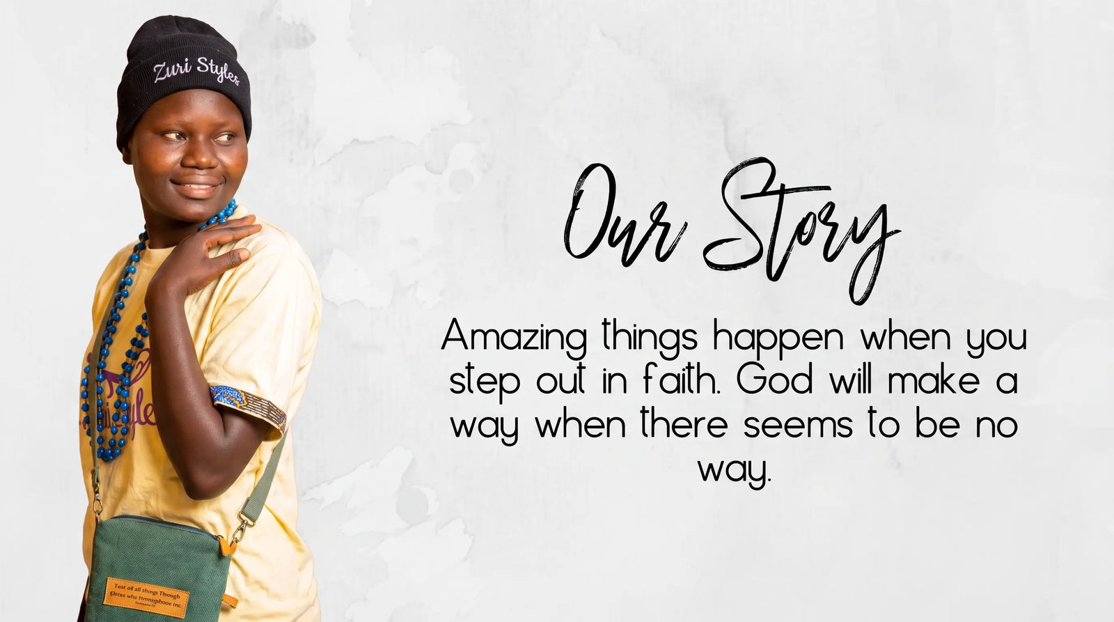 Woman in Zuri Styles beanie and yellow tee with 'Our Story' text and an inspirational quote about stepping out in faith.