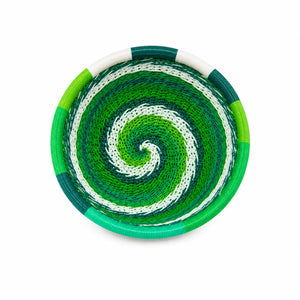 Handwoven green and white spiral Zulu telephone wire basket, vibrant African craft for home decor.
