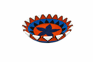 Hand-woven decorative basket bowl with a vibrant blue and orange geometric star pattern on a white background.